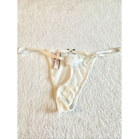 White sheer Victoria’s Secret thong new with tags with black bow detail and pom- - Picture 2 of 6